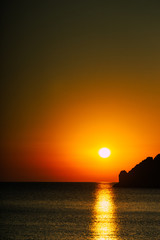 Naklejka na ściany i meble Sunset or sunrise over sea surface