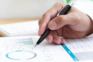 close-up Businessmen  financial  sitting  work  checking documents  using technology