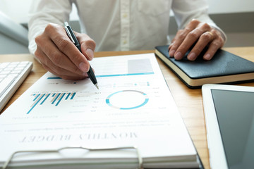 close-up Businessmen  financial  sitting  work  checking documents  using technology