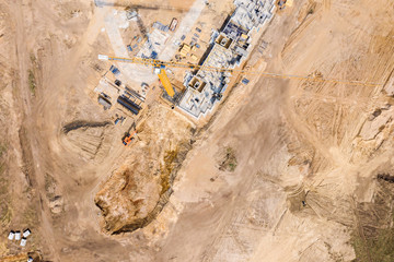aerial photo busy construction site. apartment building under construction