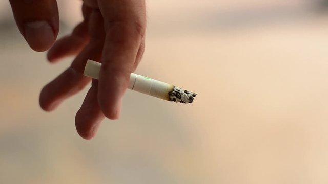Smoking at the road side.