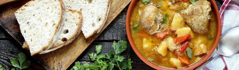 Chicken stew with potatoes and vegetables. Rustic Slow Cooker Chicken. meat and vegetables are pre-fried and then stewed. country style. top view.