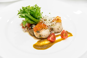 Delicious appetizer scallops with caviar.  plate fine dining restaurant