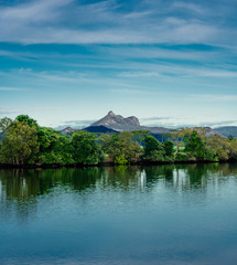 Naklejka premium Portrait panorama of Mt Warning and Tweed River at sunrise near Tumbulgum NSW Australia