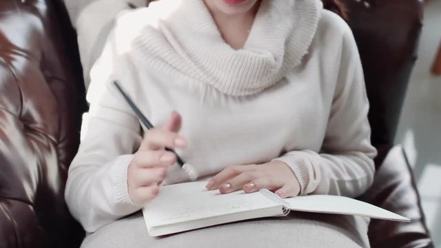 Correct wrong writing by using the eraser to correct the wrong words and create new ideas, stories in book from the university and from the surrounding environment to develop and create new things.