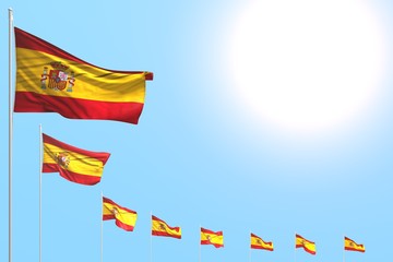beautiful many Spain flags placed diagonal on blue sky with place for content - any occasion flag 3d illustration..