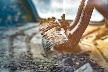 Close up view of the foot controls of a construction machinery