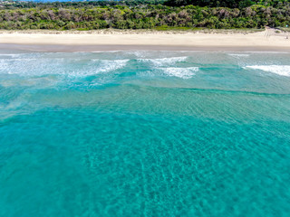 tropical beach ocean and waves with blue water Australia 