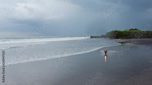 Man In Riding Motorcycle On Beach Vintage Motorbike On