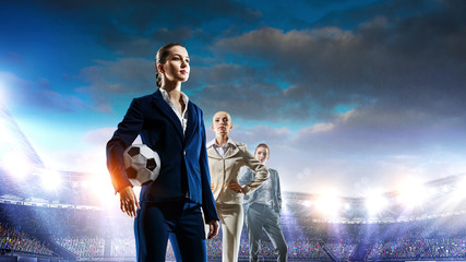 Business team on football stadium. Mixed media