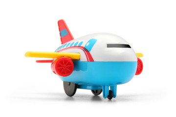 colourful plastic toy plane on white background
