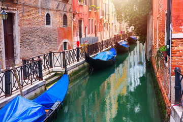 Gondolas in narrow canal in Venice, Italy. Venice cityscape