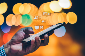 Hand using smart phone with Social media concept