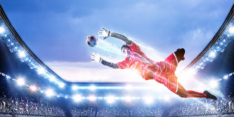 Soccer player on stadium in action. Mixed media