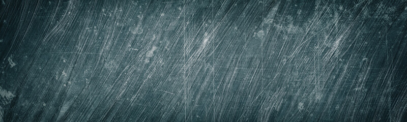 Old gray scratched and stained metal wide texture. Shabby metallic surface panorama. Dark retro...