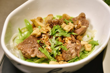 Asian noodle food, Chinese rice noodle with beef stew and fresh parsley.