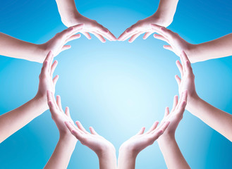 World ocean day concept: Collaborative human hands grouped in heart shape