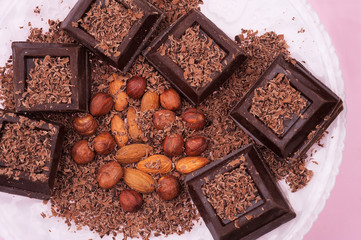Food chocolate background. Pieces of dark bitter chocolate with cocoa.