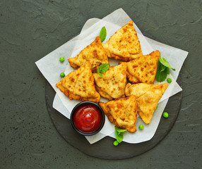 Asian food. Vegetarian samsa (samosas) with tomato sauce