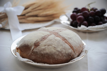 Bread, grapes and ears of wheat as a symbol of Christian Holy Communion in Italian Catholic Church.