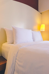 Fototapeta na wymiar Bed in hotel room