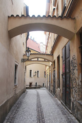 Fototapeta premium An old narrow street in Prague