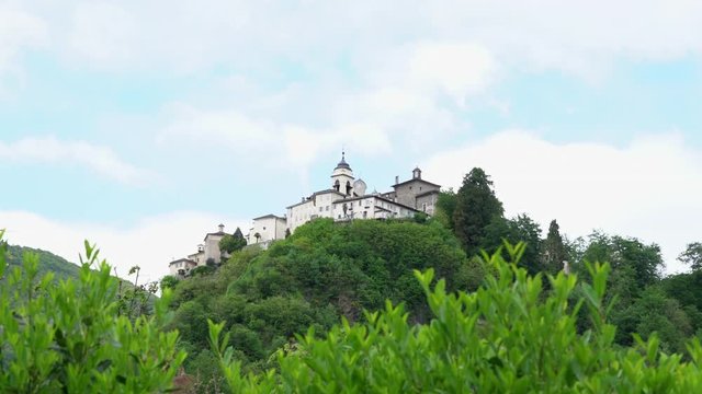 A view from the distance of the Sacred Mountain of Varallo, a christian devotional complex, a unesco world heritage si in Italy. 4k footage