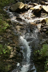 waterfall in national park. In the deep forest on mountain. mountain waterfall