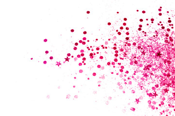 Pink glitter and glittering stars on white background in vintage colors