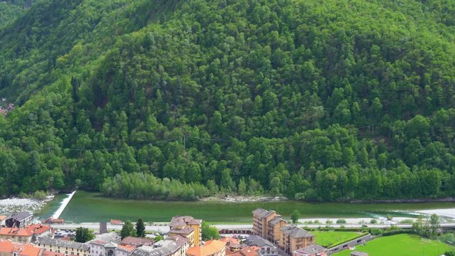Aerial panoramic view of Varallo Sesia from the Sacred Mountain of Varallo, a christian devotional complex, a unesco world heritage si in Italy. 4k footage