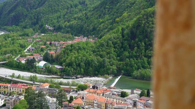 Aerial panoramic view of Varallo Sesia from the Sacred Mountain of Varallo, a christian devotional complex, a unesco world heritage si in Italy. 4k footage