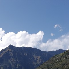 Fototapeta premium Clouds Over Mountains Like Head Over Heels