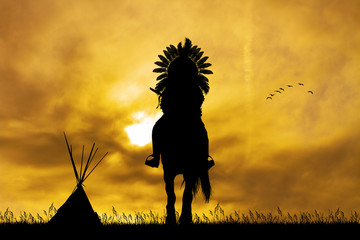 Native American Indian on horseback at sunset © adrenalinapura
