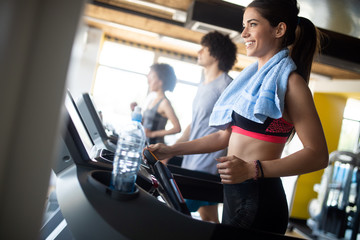 Group of sportive people in a gym. Concepts about lifestyle and sport in a fitness club