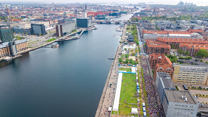 Marathon running race, aerial view of start and finish line with many runners from above, road racing, sport competition, Copenhagen marathon, Denmark