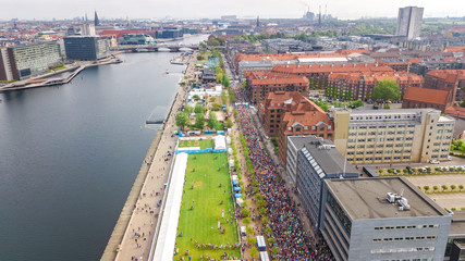 Fototapeta premium Marathon running race, aerial view of start and finish line with many runners from above, road racing, sport competition, Copenhagen marathon, Denmark