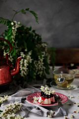 pannacotta with acacia flowers and cherry sauce.