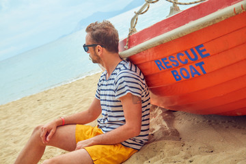 Rescue boat and lifeguard keeping the beach safe in summertime period.