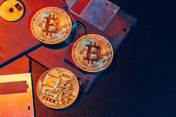 golden bitcoin on floppy disk