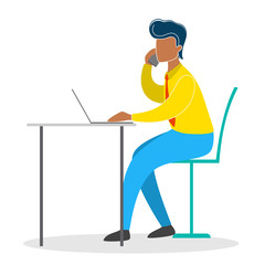 Man in a suit sitting at the desk and working