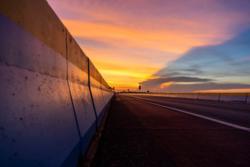 Twilight sky with silhouette of the road.