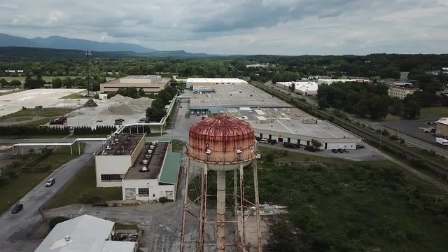 This is a drone shot circling a water tower in upstate New York.