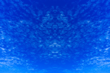 Blue sky background with white clouds.
