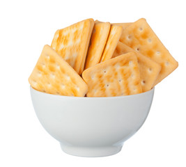 Crispy square cracker in a bowl isolated on white background