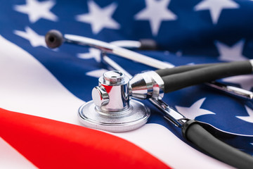 Stethoscope on American national flag, close up