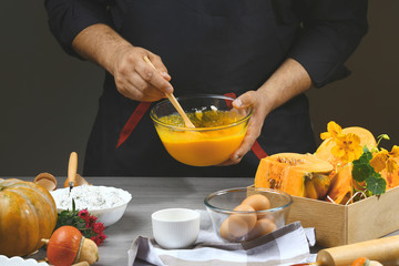 Putting pumpkin puree in the glass bowl. Preparing pumpkin puree