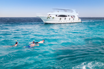 people snorkeling by boat Red Sea White yachts