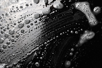 Soap foam isolated on black, with clipping path, texture and background, top view