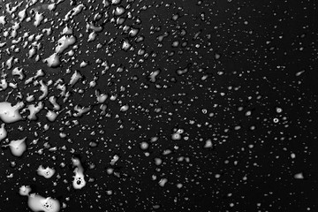 Spilled milk puddle isolated on black background and texture with clipping path, top view
