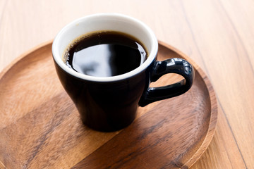 Hot coffee on a wooden table